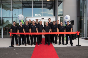 The Orthopedic Clinic's physicians stand in front of the new building ready to cut the ribbon.