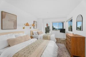 Oceans Luxury Rehab unit from the inside, with two beds and wide views to Southern California beaches