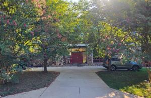 Upscale home for sale in Cabin John MD with cathedral ceilings, on a sloped lot