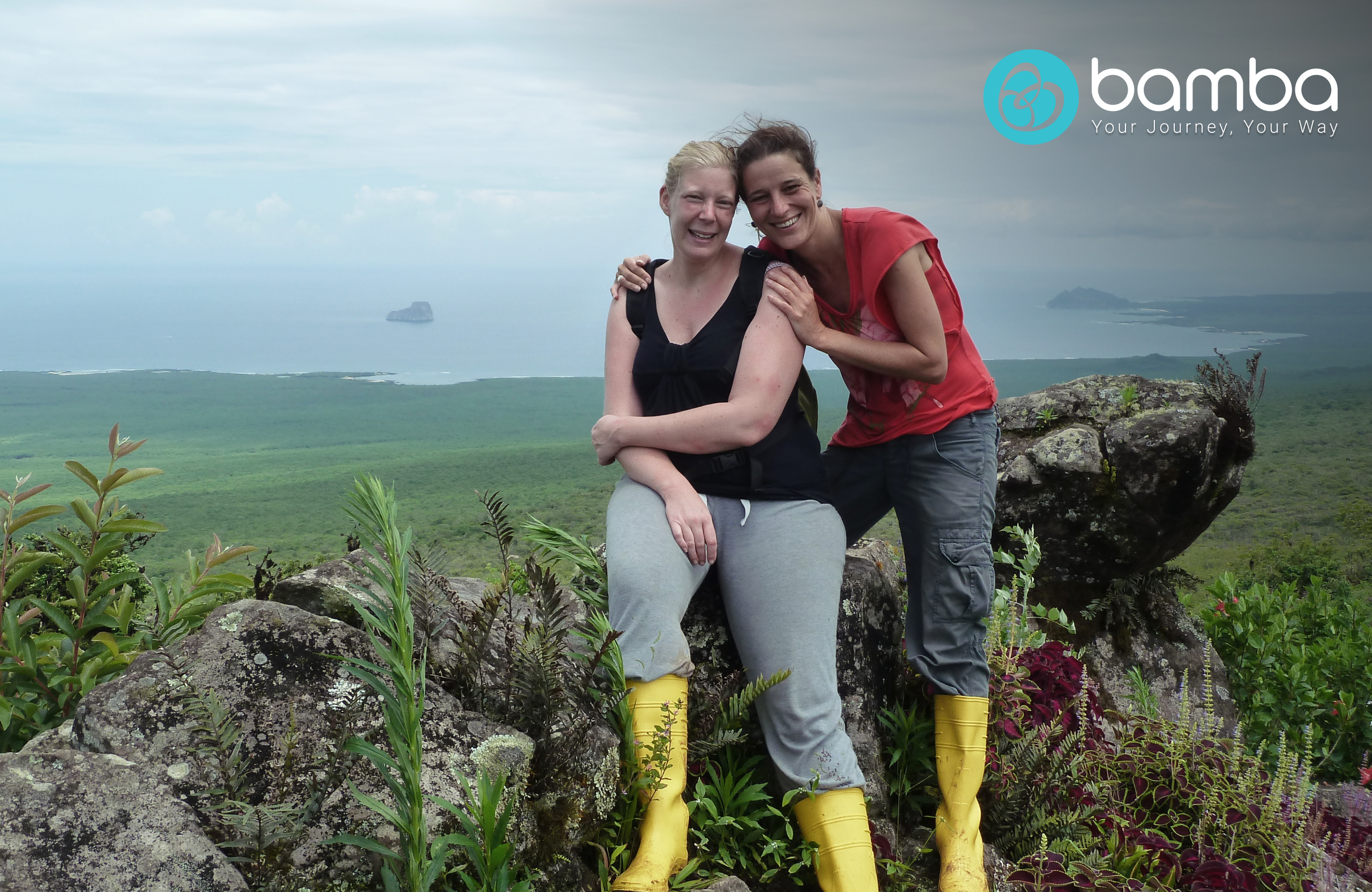 Two happy travelers smiling in Galapagos.