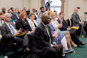 Simon Deng waits to speak on Capitol Hill