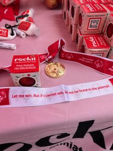 Rockit™ Apple with Special Olympics -apples and badges on a table