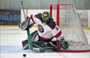 Rookie goaltender Brasco Cirillo in action, making a save during a game where he allowed only one goal from 35 shots for the Ventura Vikings.