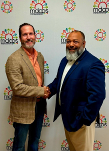 Sunnybrook Executive Director, Myrle Grate, shakes hands with Devon Loggins, CPS Deputy Commissioner of Clinical Support, After Being Awarded the Transportation & Driving Pilot Program Grant for Foster Youth