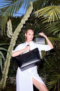 Amber Valetta holds a bag by Karl Lagerfeld.