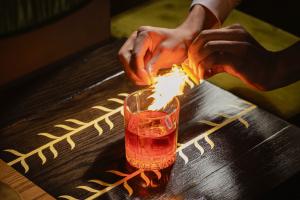 Flaming red cocktail at club room new york