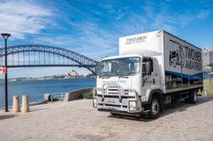 A Two Men and a Truck truck parked by Sydney Harbour with the Sydney Harbour Bridge in the background