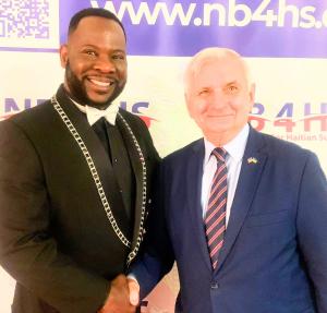 Hugues Sanon is pictured with US Senator Jack Reed at the NB4HS gala, where he received a senatorial recognition award.