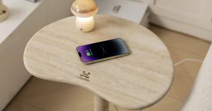 OIXDESIGN PeaPod Travertine Side Table with integrated wireless charging and a mushroom-shaped touch night light, showcasing a sleek, natural travertine stone surface.