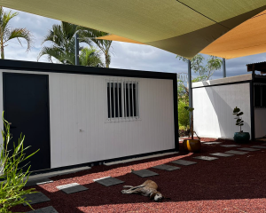 Picture of dog taking advantage of a shade sail