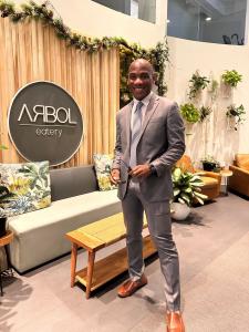 Mitchell Coles, owner of Arbol Eatery and Mitch Coles Real Estate Inc., at Arbol Eatery in Uptown Charlotte, where he leads community-driven initiatives and cross-cultural collaborations.