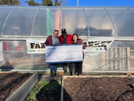 Maryland Physicians Care Sr. Director of Population Health and SDoH, Lorena de Leon, DPA, MBA, presents check to the Director of Community Choice Pantry, Carla Schroyer, and the Director of Plantation Park Heights Urban Farm, Richard Francis.