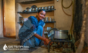 An Indian woman cooking on a Sistema.bio stove powered by biogas from a biodigester.