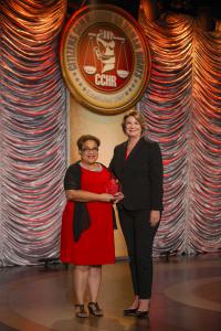 The president of the Florida chapter of CCHR presented attorney Carmen Miller with the 2018 Humanitarian Award for her work to educate citizens on their rights under the mental health law.