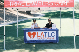 Volunteers at the LATLC Booth for the 11th Annual Golf Tournament