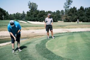 Golfers playing at the LATLC 11th Annual Golf Tournament