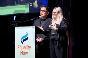 Ben Stiller and daughter Ella Stiller standing behind a podium on stage at Equality Now's Make Equality Reality gala.