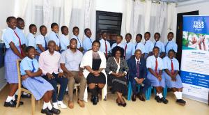 Group photo of the student co-authors of the leadership book, with their lead teachers and trainers, after a book writing training session led by Benvictor Makau (Third right, front row), Assistant Director, The Trueness Project. Photo: The Trueness Project.