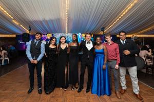 In between dancing, Bucks County Community College students gather for a group photo at the first Celebrating Student Success Gala in 2022.