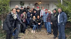 A group of US United supporters, community members and Genesee County Sheriffs gathered on the porch of a holiday spectacular recipient