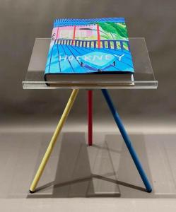 Book titled David Hockney, A Bigger Book, published by Taschen (2016) on a Plexiglas and metal stand, collector’s edition #6905 of 10,000, signed by Hockney on the frontpiece ($3,690).