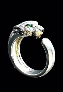 Cartier Panthère de Cartier white gold, diamond and emerald ring, so-named because it’s in the shape of a panther, set with about 72 brilliant-cut pave diamonds totaling 0.68 carats ($5,658).