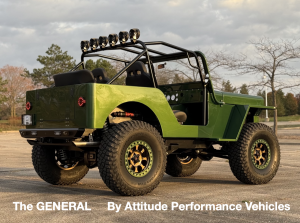 The GENERAL's beautifully proportioned aluminum body has been finished in deep metallic green paint.  The stance of the flat-fender is aggressive, with a lifted long-arm performance suspension, rolling on 39” tires and wheels finished in a dark bronze col