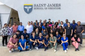 SJSM Students and Faculty in front of the new campus building