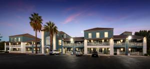 front of new affordable housing community, an apartment building with blue and white paint