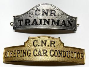 The collection of railway and trolley items will include this lot of two metal Canadian National Railway hat badges. Minimum bid: $1.