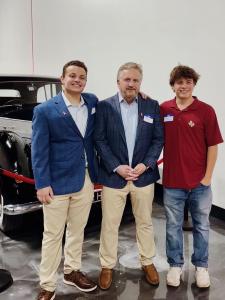 CEO & Founder Russell Gebhard viewing a vehicle owned by the Royal Family with his sons.