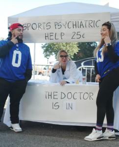 Man and woman visiting the Sports Psychiatry Booth at MetLife Stadium