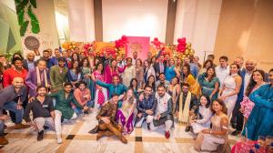 Group of attendees at Arbol Eatery's Diwali Celebration in Uptown Charlotte, dressed in colorful traditional Indian Diwali attire, posing together to celebrate culture and community.