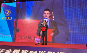 Amber Hive President Wang Feng receives an award at the Asia International Film Festival, highlighting the company's global growth in film distribution