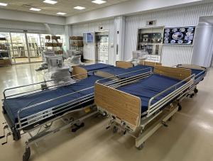 Hospital beds for Ukraine in a loading dock