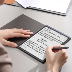 Someone taking notes on the iFLYTEK AINOTE Air 2 paper tablet, which has a paper-like screen for a natural writing experience.