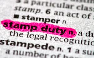 close up photo of the words stamp duty in a dictionary book