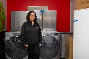 Whirlpool associate standing and smiling