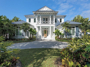 This rare double-lot estate just four doors from the beach showcases exceptional design, with 6 bedrooms, 7.5 bathrooms, a loft with wet bar and two expansive outdoor areas.