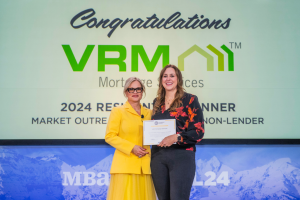 Award presentation from MBA current Chair of the Board of Directors, Laura Escobar to VRM Mortgage Services Director of Marketing, Brittany White