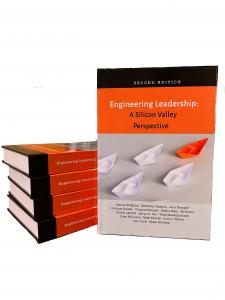 Picture of the new book on Engineering Leadership with a stack of books behind it.