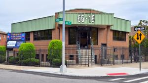 Cross Bay Orthopedic Surgery's building, it's a brown brick building with a green roof,