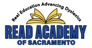 READ Academy logo featuring an open book graphic, the tagline 'Real Education Advancing Dyslexics,' and the text 'READ Academy of Sacramento.