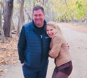 Photo of a man and woman standing together outside