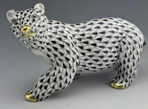 Large porcelain Herend signed black fishnet pattern polar bear with 24k gold accents, about 5 ½ inches in length (est. $480-$650).