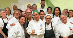 Chef Leite shared her expertise in Brazilian gastronomy with her Newark students, here proudly wearing custom-embroidered chef coats sourced and emroidered by Work Hard Dress Right.