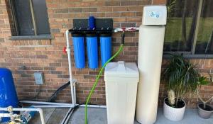 Technician installing water filter for clean water.