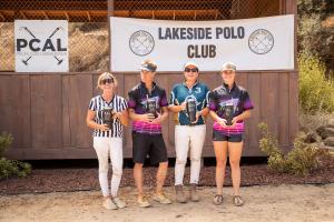 4 people having a good time showing off their prizes