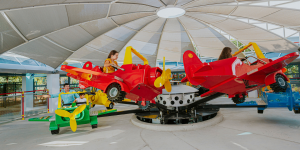 Families enjoying the LEGO City Airport ride at the Legoland Dubai Resort