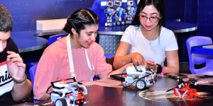 An autistic child enjoying the activities at Legoland Dubai Resort with her carer